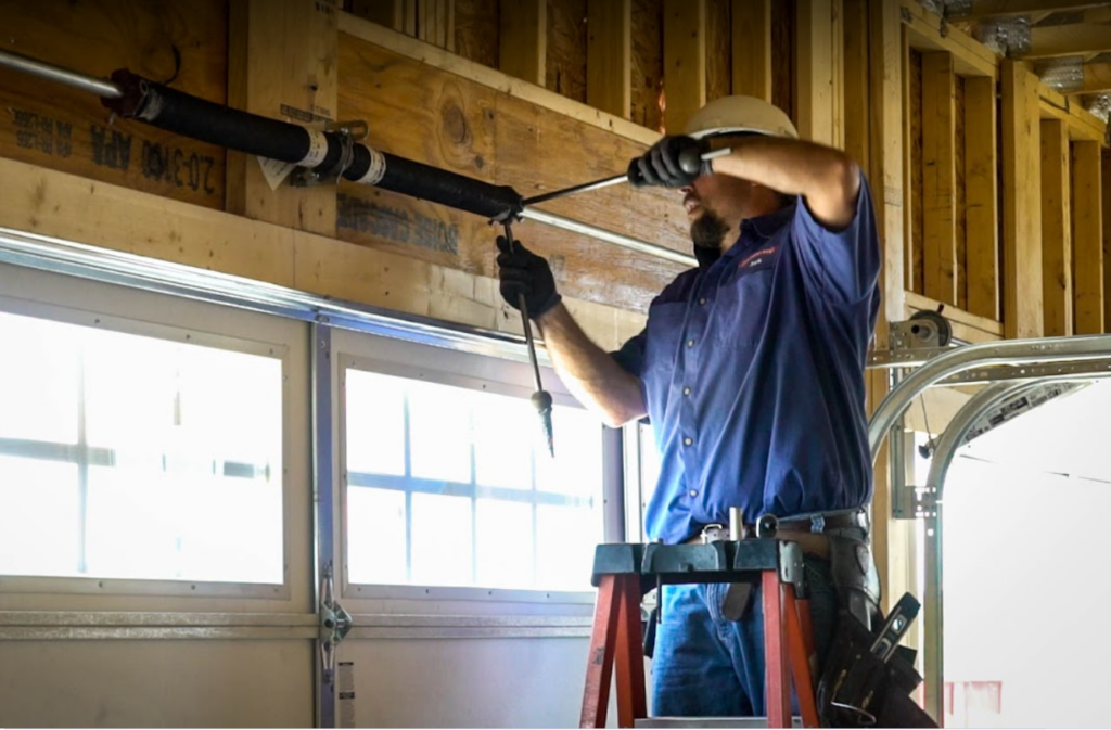 Professional technician repairing a garage door in tenafly nj