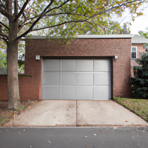 Suburban Tenafly driveway with a modern steel garage door on a brick home, overcast sky, street and trees visible.