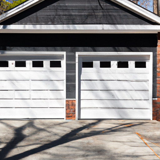 Sectional garage door on a Tenafly residence, showing tracks, panels, and weatherstripping, exterior in daylight.