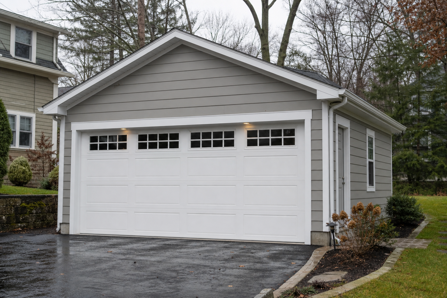 Suburban garage door on a Tenafly home with clean weatherproofing details